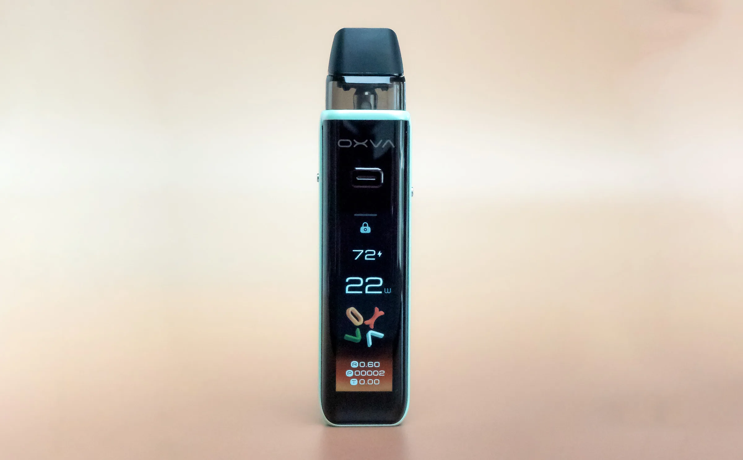 A sleek vape device with a digital display showing settings, including temperature and wattage, against a soft background.
